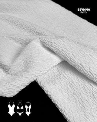 Tissu en double maille jacquard tricoté pour des produits textiles durables et polyvalents