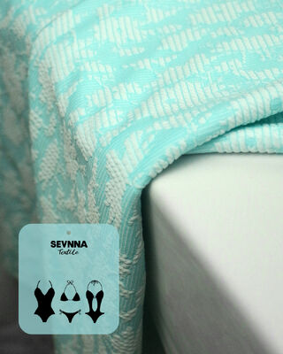 Tissu de bain texturé de qualité supérieure, largeur 135cm, poids 195gsm et composition 50% polyester recyclé