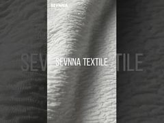 Tissu en double maille jacquard tricoté pour des produits textiles durables et polyvalents