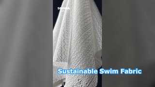 Tissu de maillot de bain écologique fabriqué à partir de plastiques océaniques recyclés et de fibres durables offrant une protection écologique